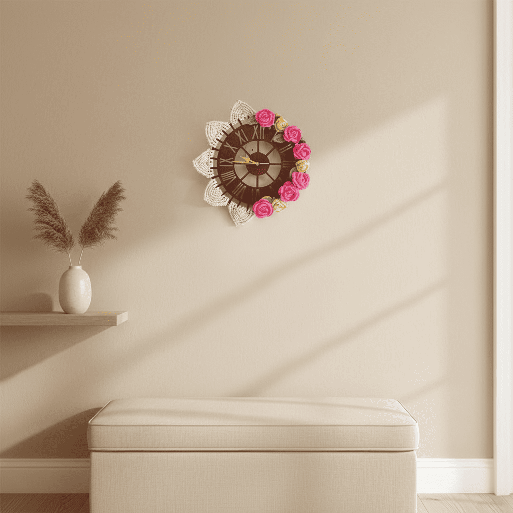 Decorative wall clock with floral design on a beige wall, next to a white vase with dried plants and a white cushioned bench.