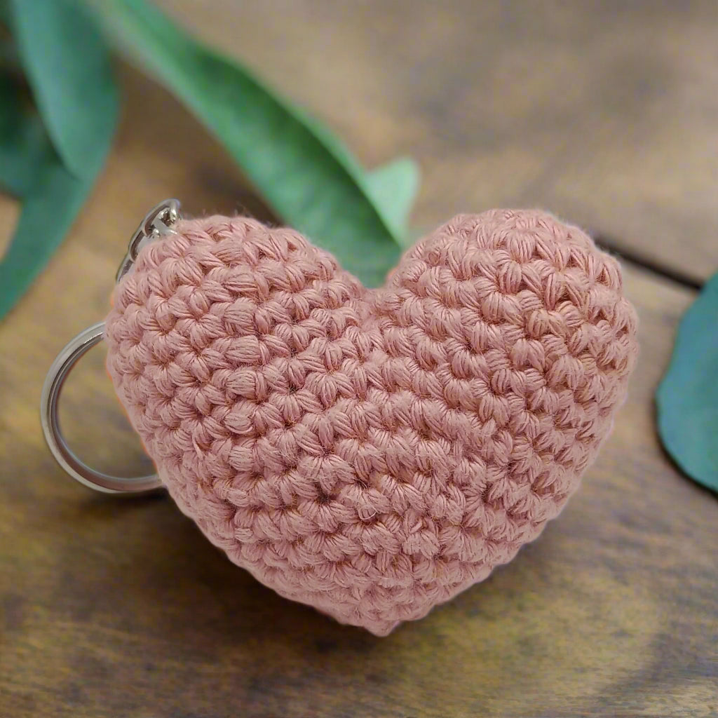 Peach crocheted heart-shaped keychain