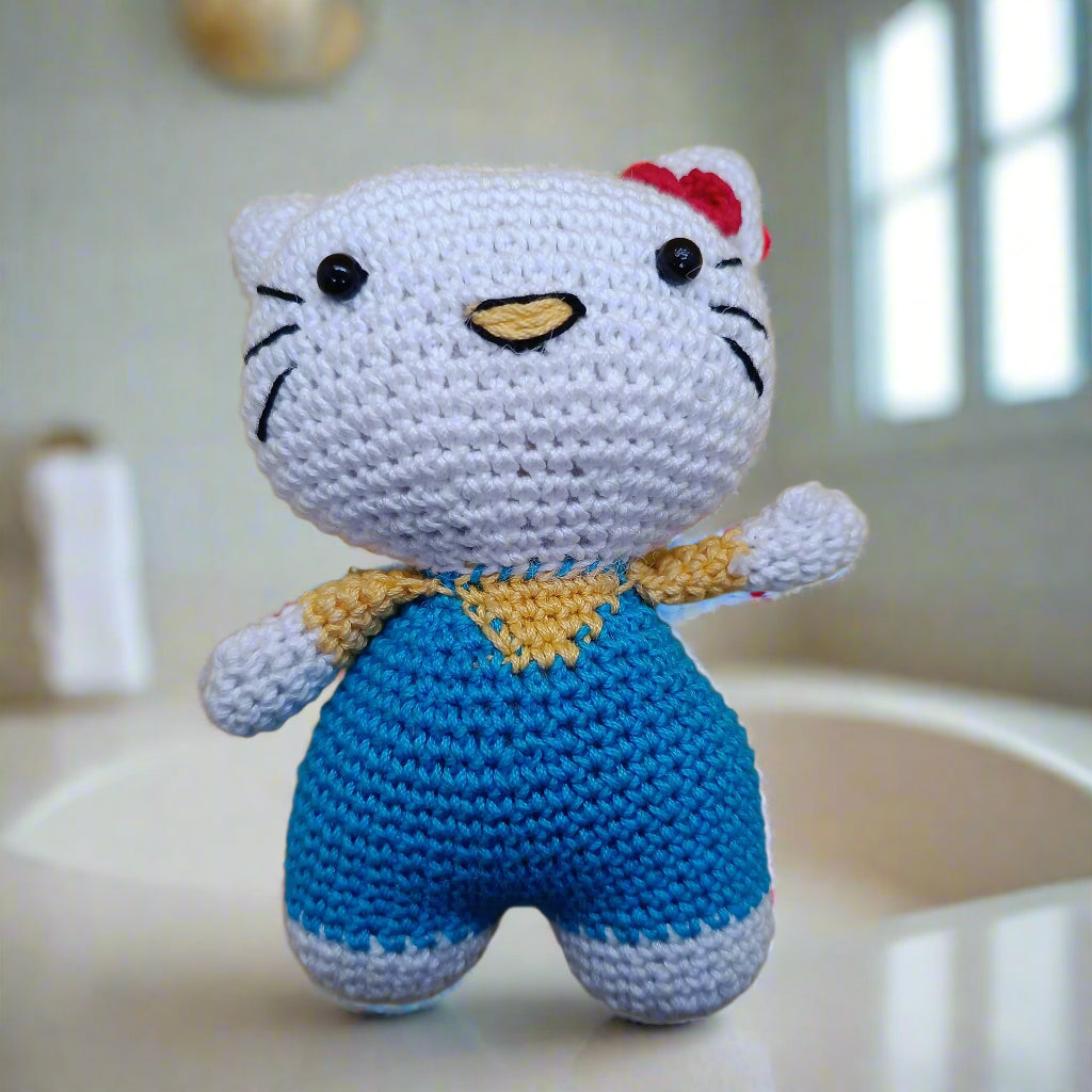 Crocheted Hello Kitty toy with a red bow, soft toy for kids