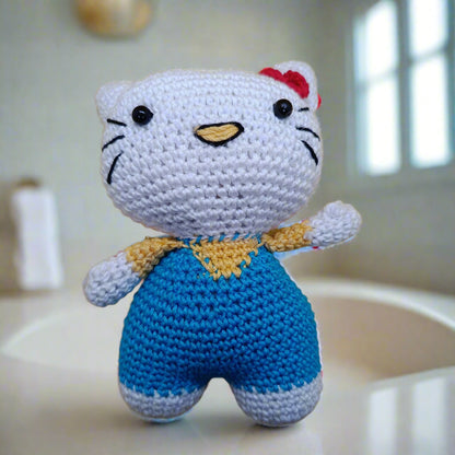 Crocheted Hello Kitty toy with a red bow, soft toy for kids